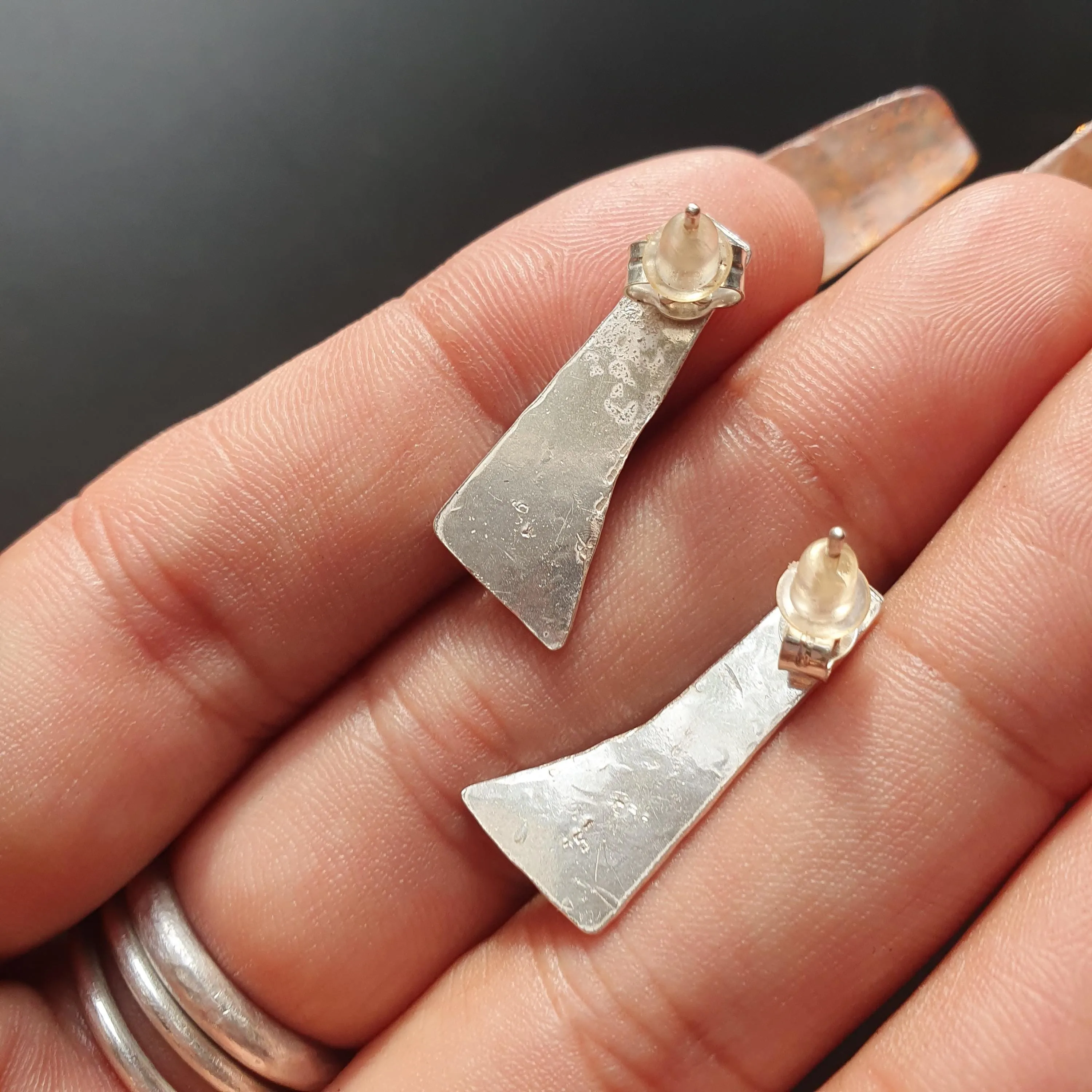 Pair of unique handcrafted earrings, Asymmetrical, textured design, triangular shape,tear drop detail,hammered finish, artisanal,silver, 925