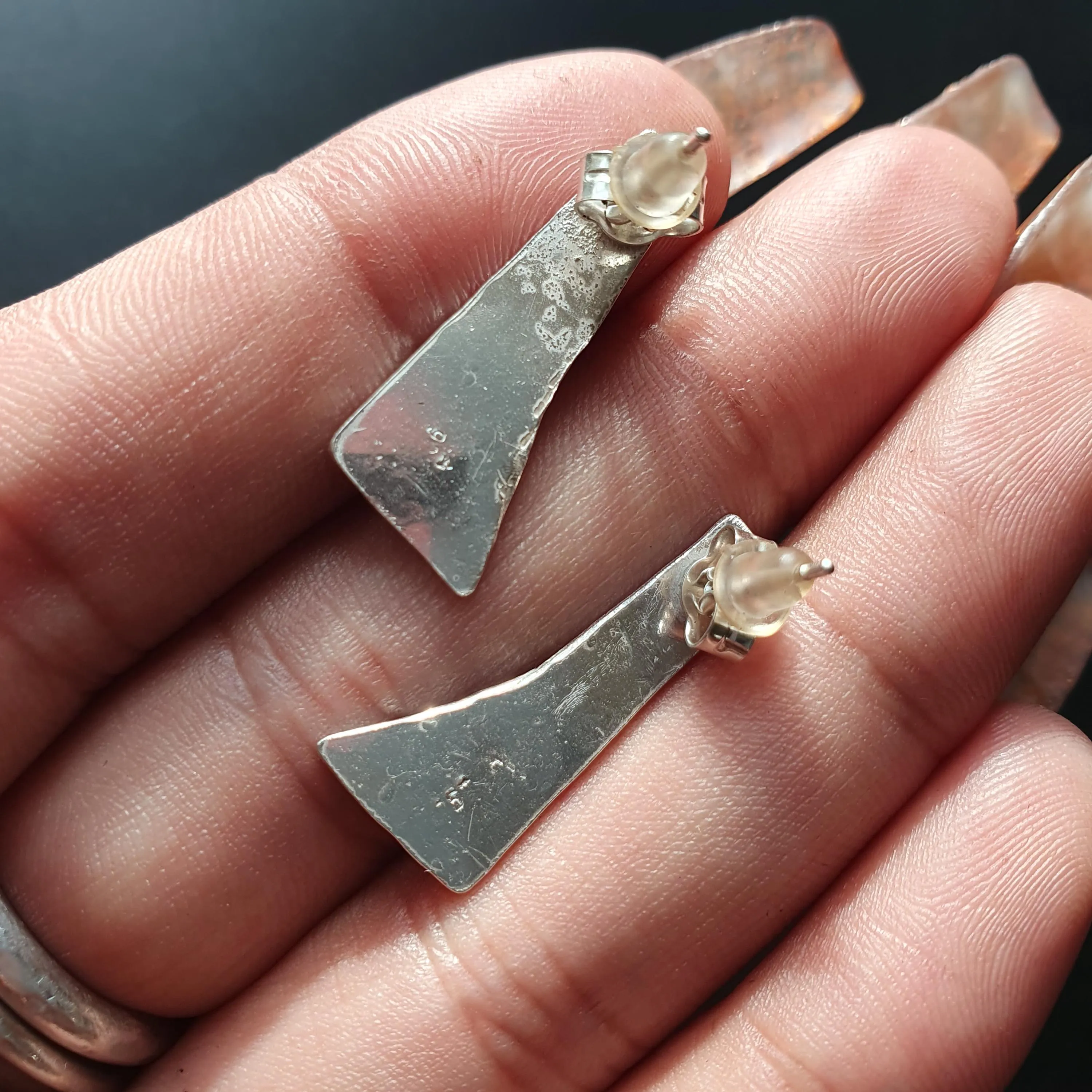 Pair of unique handcrafted earrings, Asymmetrical, textured design, triangular shape,tear drop detail,hammered finish, artisanal,silver, 925