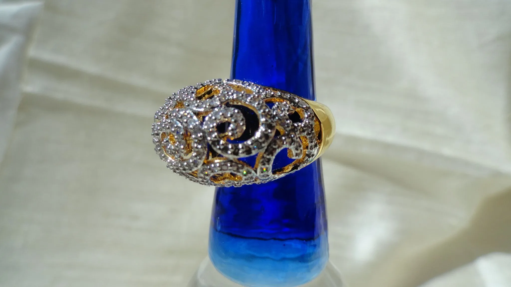 "Cascades" Ethnic finger ring. Indian finger ring with white stones in waves.  Brass finished gold Party or wedding ring. From Artikrti.